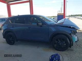 2021 Mazda CX-5 Touring with VIN JM3KFBCM3M0406787, listed as a IAAI auction lot 41800564 with 42,254 mi miles and . Bid and sale history available at carsss.com. Image 14.