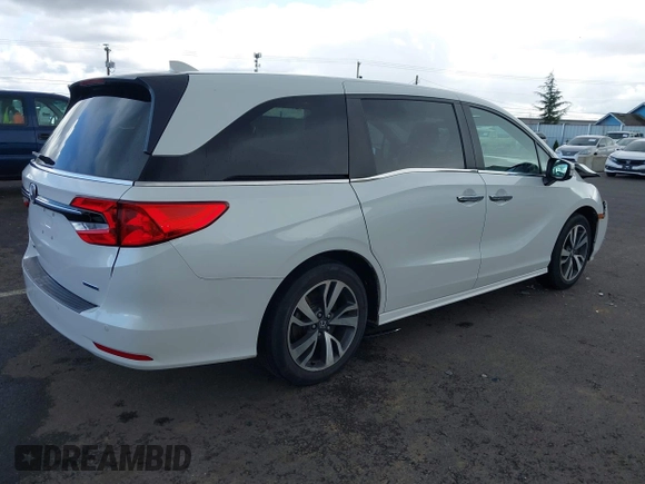 2022 Honda Odyssey Touring with VIN 5FNRL6H8XNB057293, listed as a IAAI auction lot 41826014 with 30,454 mi miles and . Bid and sale history available at DreamBid. Image 4.