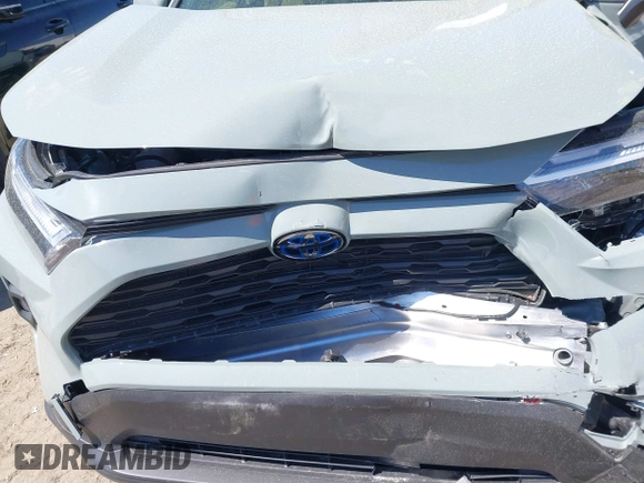 2023 Toyota RAV4 Hybrid XLE Premium z VIN JTMB6RFV8PD116502, wystawiony jako IAAI lot #41888174 z przebiegiem 19 253 mil mil oraz . Historia ofert i sprzedaży dostępna na DreamBid. Obrazek 6.