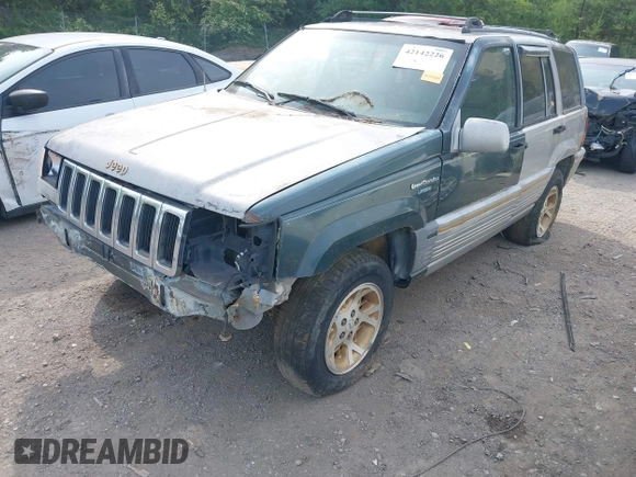1994 Jeep Grand Cherokee Laredo z VIN 1J4GZ58Y1RC265589, wystawiony jako IAAI lot #42142226 z przebiegiem 138 656 mil mil oraz . Historia ofert i sprzedaży dostępna na DreamBid. Obrazek 2.