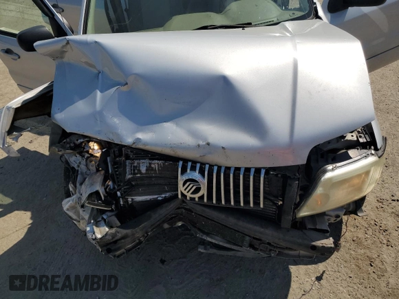 2005 Mercury Mariner Luxury z VIN 4M2YU56165DJ21260, wystawiony jako Copart lot #67528354 z przebiegiem Nie podano mil oraz Szkoda całkowita • Salvage title. Historia ofert i sprzedaży dostępna na DreamBid. Obrazek 12.