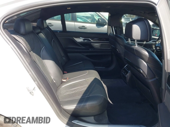2019 BMW 7 Series 750i with VIN WBA7F0C5XKGM25771, listed as a IAAI auction lot 42167614 with 73,692 mi miles. Bid and sale history available at carsss.com. Image 8.
