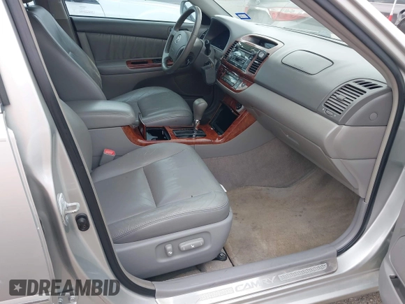 2006 Toyota Camry LE z VIN 4T1BF32K86U119208, wystawiony jako IAAI lot #42127284 z przebiegiem 99 864 mil mil oraz . Historia ofert i sprzedaży dostępna na DreamBid. Obrazek 5.