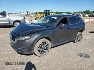 2018 Mazda CX-5 Touring z VIN JM3KFACM2J1458055, wystawiony jako Copart lot #54851555 z przebiegiem 95 089 mil mil oraz Szkoda całkowita • Salvage title. Historia ofert i sprzedaży dostępna na DreamBid. Obrazek 1.