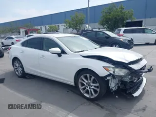 2016 Mazda Mazda6 i Touring with VIN JM1GJ1V57G1429887, listed as a IAAI auction lot 42029170 with 140,519 mi miles. Bid and sale history available at carsss.com. Image 1.