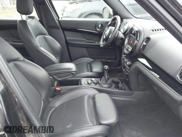 2019 MINI Countryman Cooper S z VIN WMZYT5C5XK3E69664, wystawiony jako IAAI lot #42385669 z przebiegiem 64 761 mil mil oraz . Historia ofert i sprzedaży dostępna na DreamBid. Obrazek 5.