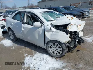 2010 Kia Forte LX with VIN KNAFT4A28A5858147, listed as a IAAI auction lot 41599005 with 124,445 mi miles. Bid and sale history available at carsss.com. Image 1.