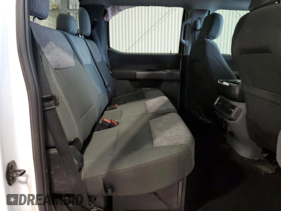 2023 Ford F-150 Lightning Pro z VIN 1FT6W1EV3PWG34249, wystawiony jako Copart lot #46901535 z przebiegiem 9 389 mil mil oraz Szkoda całkowita • Salvage title. Historia ofert i sprzedaży dostępna na DreamBid. Obrazek 10.