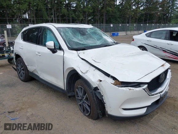 2018 Mazda CX-5 Grand Touring with VIN JM3KFBDM1J0382306, listed as a IAAI auction lot 42554947 with 121,303 mi miles and . Bid and sale history available at DreamBid. Image 1.