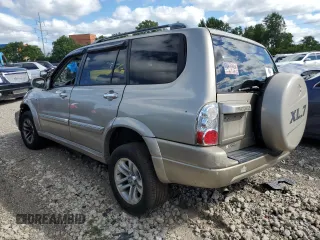 2005 Suzuki XL7 LX z VIN JS3TX92V854105506, wystawiony jako Copart lot #60683524 z przebiegiem 197 035 mil mil oraz Szkody całkowita. Historia ofert i sprzedaży dostępna na DreamBid. Obrazek 2.