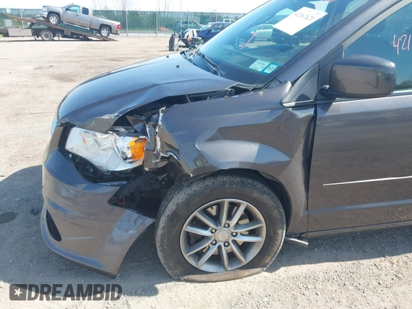2015 Dodge Grand Caravan SE with VIN 2C4RDGBG2FR684367, listed as a IAAI auction lot 42167621 with 216,628 mi miles and . Bid and sale history available at DreamBid. Image 6.