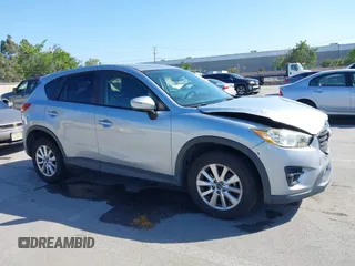 2016 Mazda CX-5 Touring z VIN JM3KE2CY8G0631359, wystawiony jako IAAI lot #42204589 z przebiegiem 182 181 mil mil oraz . Historia ofert i sprzedaży dostępna na DreamBid. Obrazek 1.
