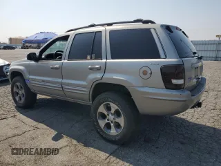 2001 Jeep Grand Cherokee Limited with VIN 1J4GW58N11C721108, listed as a Copart auction lot 60176915 with 257,907 mi miles and Salvage title. Bid and sale history available at DreamBid. Image 2.