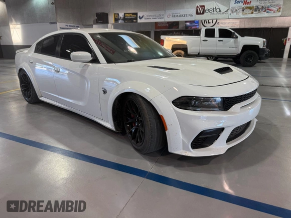 2021 Dodge Charger SRT Hellcat Widebody z VIN 2C3CDXL93MH662407, wystawiony jako Copart lot #58264615 z przebiegiem 56 012 mil mil oraz Czysty tytuł • Clean title. Historia ofert i sprzedaży dostępna na DreamBid. Obrazek 1.