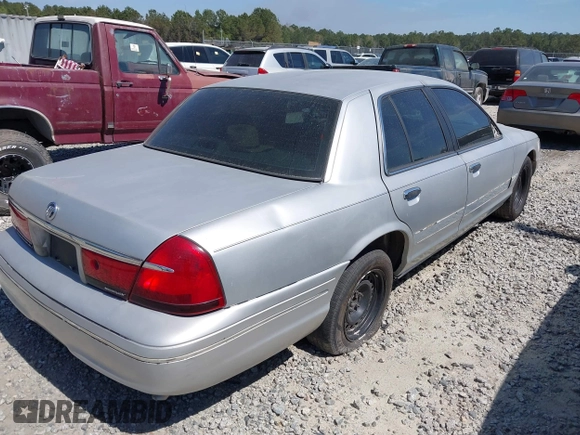2001 Mercury Grand Marquis GS z VIN 2MEFM74W71X671429, wystawiony jako IAAI lot #41684570 z przebiegiem 155 334 mil mil oraz . Historia ofert i sprzedaży dostępna na DreamBid. Obrazek 4.