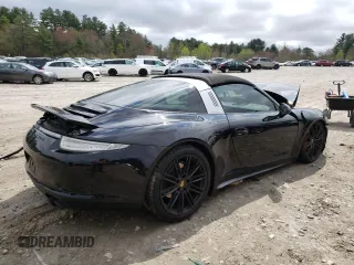 2016 Porsche 911 4S with VIN WP0BB2A94GS136383, listed as a Copart auction lot 52737084 with 54,027 mi miles and Salvage Title. Bid and sale history available at carsss.com. Image 3.