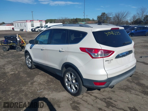 2016 Ford Escape Titanium with VIN 1FMCU9J96GUB65441, listed as a IAAI auction lot 41412223 with 74,218 mi miles. Bid and sale history available at carsss.com. Image 3.