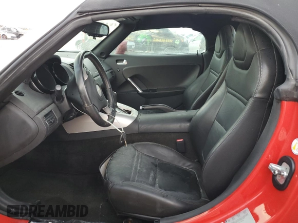 2009 Saturn Sky z VIN 1G8MN35B79Y103875, wystawiony jako Copart lot #74669844 z przebiegiem Nie podano mil oraz Szkody całkowita. Historia ofert i sprzedaży dostępna na DreamBid. Obrazek 7.