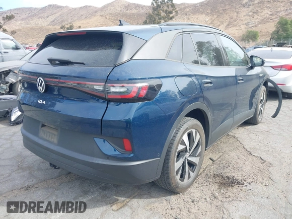 2023 Volkswagen ID.4 Pro z VIN 1V2DNPE8XPC019169, wystawiony jako IAAI lot #41313501 z przebiegiem 32 552 mil mil oraz . Historia ofert i sprzedaży dostępna na DreamBid. Obrazek 4.