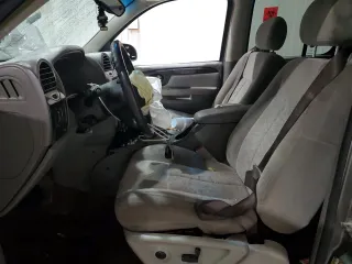 2005 GMC Envoy SLE с VIN 1GKDS13S752274178, выставлен на аукционе Copart как лот 55289005 с пробегом 199 378 миль миль и Списание • Salvage title. История ставок и продаж доступна на DreamBid. Изображение 7.