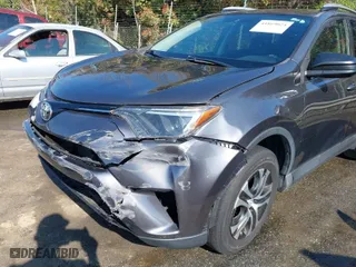 2016 Toyota RAV4 LE with VIN 2T3ZFREV7GW305998, listed as a IAAI auction lot 41869024 with 163,463 mi miles. Bid and sale history available at carsss.com. Image 6.