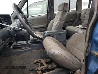 1991 Jeep Cherokee with VIN 1J4FJ58S1ML520376, listed as a Copart auction lot 75452364 with 147,982 mi miles and Salvage title. Bid and sale history available at DreamBid. Image 7.