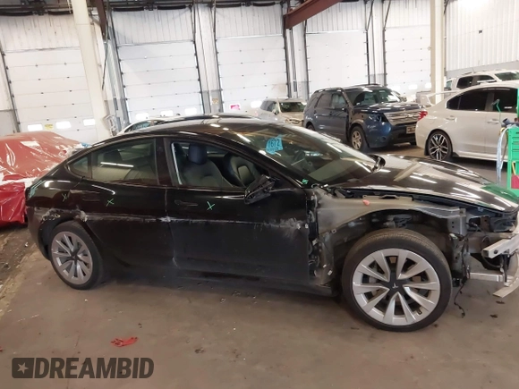 2022 Tesla Model 3 with VIN 5YJ3E1EA4NF187113, listed as a IAAI auction lot 41712331 with 81,879 mi miles and . Bid and sale history available at DreamBid. Image 14.