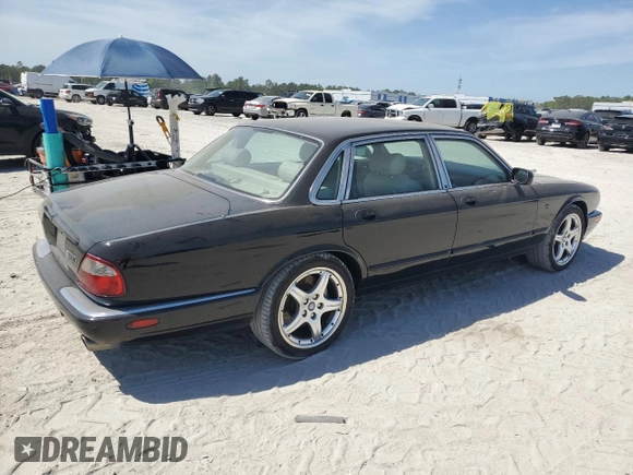 2003 Jaguar XJ with VIN SAJDA15B83MF58887, listed as a Copart auction lot 51057895 with 189,770 mi miles and Clean title. Bid and sale history available at DreamBid. Image 3.