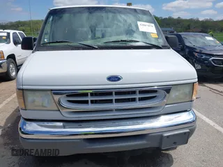 1999 Ford Econoline Cargo Recreational with VIN 1FDRE14L2XHA41059, listed as a IAAI auction lot 42067879 with 149,185 mi miles. Bid and sale history available at carsss.com. Image 12.