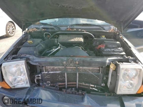 2006 Jeep Commander with VIN 1J8HH48N46C133122, listed as a Copart auction lot 80821094 with 216,412 mi miles and Salvage Title. Bid and sale history available at carsss.com. Image 12.