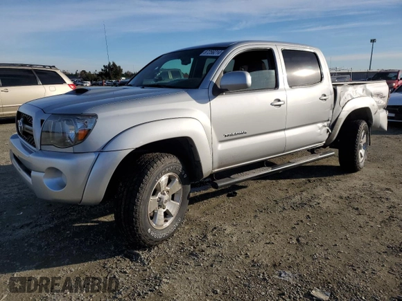 2011 Toyota Tacoma PreRunner with VIN 3TMJU4GN7BM114871, listed as a Copart auction lot 87256214 with 214,236 mi miles and Salvage Title. Bid and sale history available at DreamBid. Image 1.