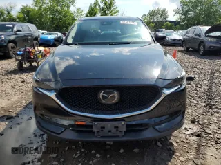 2018 Mazda CX-5 Grand Touring with VIN JM3KFBDM6J0345848, listed as a Copart auction lot 61587865 with 107,193 mi miles and Salvage title. Bid and sale history available at DreamBid. Image 5.