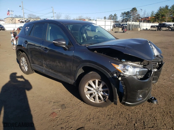 2016 Mazda CX-5 Touring with VIN JM3KE4CY7G0815137, listed as a Copart auction lot 50444665 with 61,681 mi miles and Salvage Title. Bid and sale history available at carsss.com. Image 4.