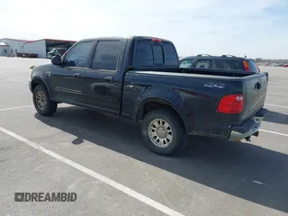 2003 Ford F-150 XLT with VIN 1FTRW08L83KA14760, listed as a IAAI auction lot 41820943 with 215,130 mi miles. Bid and sale history available at carsss.com. Image 3.