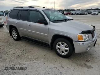 2004 GMC Envoy SLT with VIN 1GKDT13S742106035, listed as a Copart auction lot 77692884 with 122,188 mi miles and Non Repairable. Bid and sale history available at DreamBid. Image 4.
