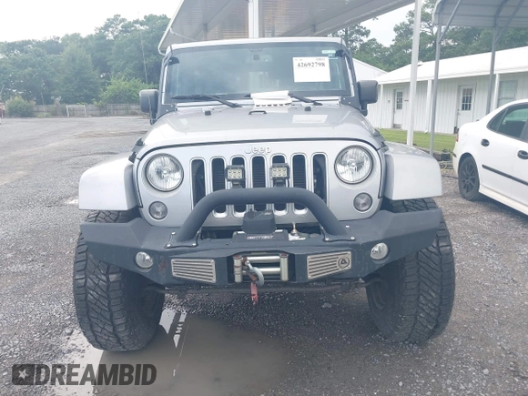 2016 Jeep Wrangler Unlimited Sahara with VIN 1C4BJWEG5GL117872, listed as a IAAI auction lot 42692798 with 119,819 mi miles and . Bid and sale history available at DreamBid. Image 12.