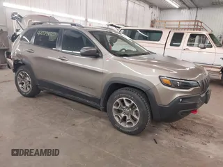 2021 Jeep Cherokee Trailhawk z VIN 1C4PJMBX5MD231018, wystawiony jako IAAI lot #42029850 z przebiegiem 66 525 mil mil oraz . Historia ofert i sprzedaży dostępna na DreamBid. Obrazek 1.