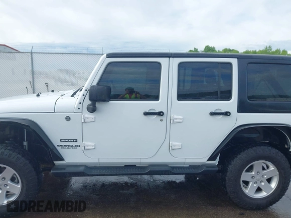 2013 Jeep Wrangler Unlimited Sport with VIN 1C4BJWDG4DL599151, listed as a IAAI auction lot 42212831 with 143,865 mi miles and . Bid and sale history available at DreamBid. Image 14.