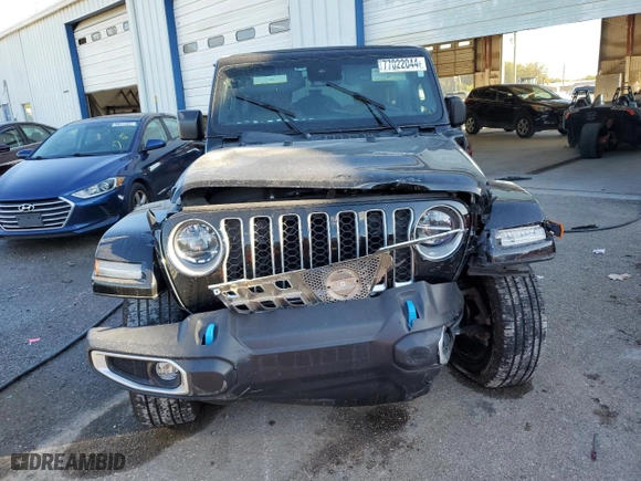 2022 Jeep Wrangler 4xe Unlimited Sahara with VIN 1C4JJXP61NW277801, listed as a Copart auction lot 48733695 with 26,621 mi miles and Salvage Title. Bid and sale history available at carsss.com. Image 5.