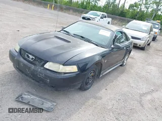 2000 Ford Mustang with VIN 1FAFP4048YF163834, listed as a IAAI auction lot 42090407 with 161,928 mi miles. Bid and sale history available at carsss.com. Image 2.