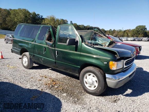 1999 Ford Econoline Passenger XL with VIN 1FBSS31L0XHB12679, listed as a Copart auction lot 74257504 with 136,821 mi miles and Salvage Title. Bid and sale history available at DreamBid. Image 4.