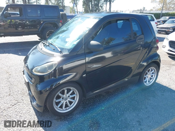 2009 Smart fortwo Pure z VIN WMEEJ31X49K218655, wystawiony jako IAAI lot #40850458 z przebiegiem 243 075 mil mil oraz . Historia ofert i sprzedaży dostępna na DreamBid. Obrazek 16.