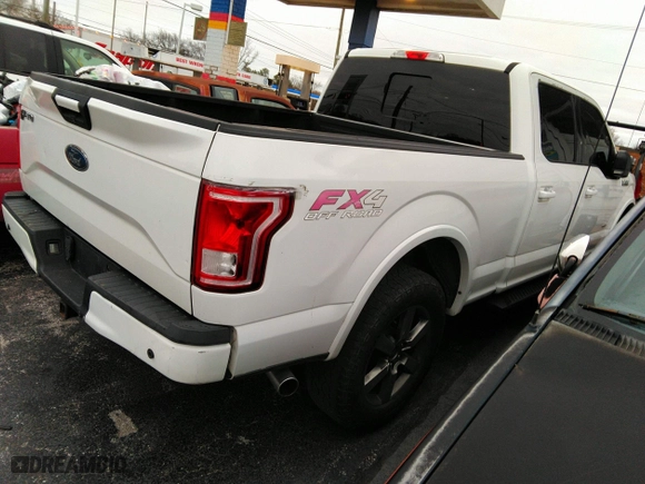 2015 Ford F-150 XLT w/HD Payload Pkg with VIN 1FTFW1EG8FFA12438, listed as a IAAI auction lot 41743982 with 174,799 mi miles. Bid and sale history available at carsss.com. Image 4.