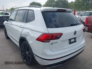 2021 Volkswagen Tiguan SE with VIN 3VV3B7AX9MM003432, listed as a IAAI auction lot 41914477 with 64,530 mi miles and . Bid and sale history available at DreamBid. Image 3.
