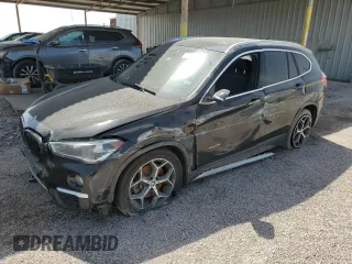 2018 BMW X1 sDrive28i with VIN WBXHU7C33J5H42084, listed as a Copart auction lot 48239035 with 65,717 mi miles and Clean Title. Bid and sale history available at carsss.com. Image 1.