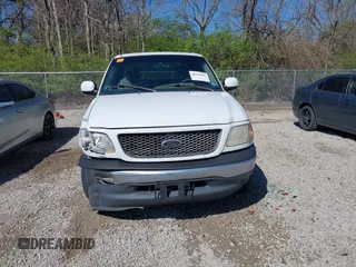2001 Ford F-150 XL z VIN 1FTRX17L61NB26764, wystawiony jako IAAI lot #42049452 z przebiegiem 242 585 mil mil oraz . Historia ofert i sprzedaży dostępna na DreamBid. Obrazek 13.