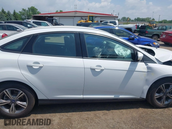2018 Ford Focus SE z VIN 1FADP3FE5JL267982, wystawiony jako IAAI lot #42646881 z przebiegiem 40 163 mil mil oraz . Historia ofert i sprzedaży dostępna na DreamBid. Obrazek 13.