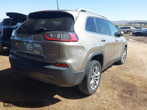 2021 Jeep Cherokee Altitude with VIN 1C4PJLLBXMD155096, listed as a IAAI auction lot 41746319 with 99,423 mi miles and . Bid and sale history available at DreamBid. Image 4.