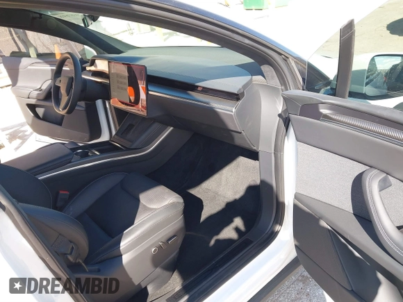 2023 Tesla Model X Plaid with VIN 7SAXCBE63PF405105, listed as a IAAI auction lot 41876918 with 22,475 mi miles and . Bid and sale history available at DreamBid. Image 5.