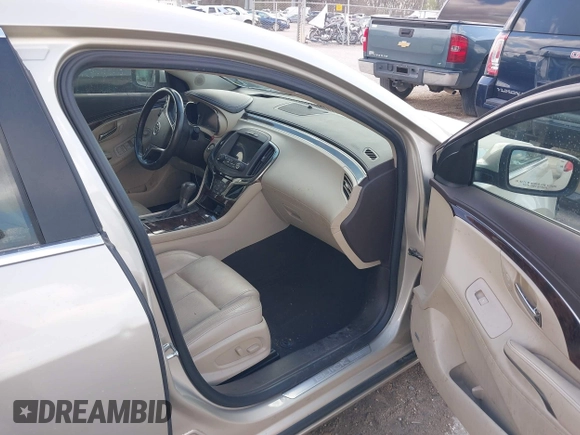 2014 Buick LaCrosse Premium II with VIN 1G4GF5G32EF129559, listed as a IAAI auction lot 41780260 with 120,487 mi miles and . Bid and sale history available at DreamBid. Image 5.